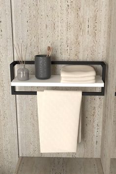 a towel rack with two rolls of toilet paper on it