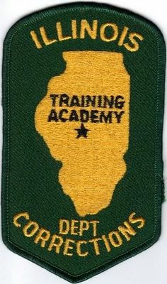 the illinois training academy patch is green and yellow with gold trimmings on it