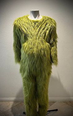 a mannequin dressed in bright green fur