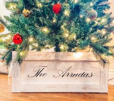 a christmas tree in a wooden box with the words the arndtas on it