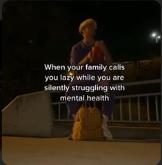 a person sitting on top of a suitcase with the caption when your family calls you lazy while you are silently struggling with mental health