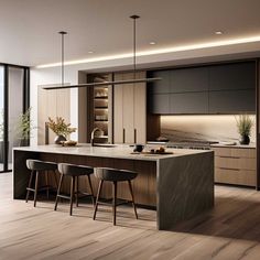 a modern kitchen with an island and bar stools