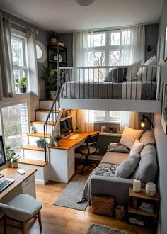 a loft bed with a desk underneath it and stairs leading up to the second floor