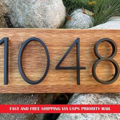 a wooden sign that says 1044 fast and free shipping via us priority mail