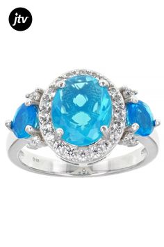 1.00ct Oval And 0.35ctw Round Paraiba Blue Color Ethiopian Opal With 0.25ctw Round White Zircon Rhodium Over Sterling Silver Ring. Measures Approximately 0.86"L x 0.51"W. Not Sizeable.  Accent stones primarily zircon. Blue Diamond Ring With Gemstone Accents, Oval Shape, Blue Oval Diamond Ring With Gemstone Accents, Blue Cubic Zirconia Halo Ring With Accent Stones, Blue Halo Ring With Accent Stones, Ethiopian Opal, Sterling Silver Ring, Silver Ring, Sterling Silver Rings, Opal