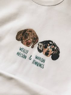 two dogs embroidered onto a white t - shirt that says willie, wilson & tenniss