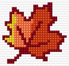 a cross stitch pattern with an orange and yellow object on it's back side