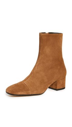 PRICES MAY VARY. Leather sole with rubber heel cap Heel: 1.75in / 45mm Leather lining Casual Square toe Simple, sleek, and versatile these STAUD booties are a must-have pair of ankle boots crafted in rich, earth-tone suede. Equally appropriate for pairing with dresses or denim, they're bound to be a new go-to for fall. Effortless Fall Outfits, How To Wear Ankle Boots, Statement Sandals, Heel Caps, Boots Fall, Rubber Heels, Short Boots, Mid Calf, Chelsea Boots