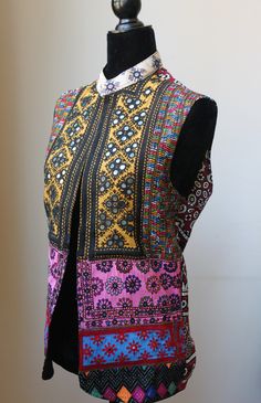 This Patchwork jacket is made of Hand embroidered panels stitched together to form a boho style vest. These embroidered patches were sourced from Tharparkar region of Sindh and some parts of Balochistan. Each section of embroidery consists of different styles of threadwork and mirror work native to the region, with some overlapping techniques of Baloch styles. Some of the styles of embroidery included are but not limited to: kaacha taanka, mirror work, Balochi tanka. The fabric itself has been e Work Blazer, Embroidered Scarf, Style Vest, Patchwork Jacket, Pashmina Shawl, Unisex Jacket, Scarf Gift, Wardrobe Ideas, Sleeveless Jacket