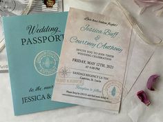 two wedding passport cards sitting on top of each other