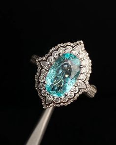 "This ring features a (8x13mm oval cut lab Made Paraiba Tourmaline). It is made by hand, and it will take about 6 to 8 days to finish the ring after your payment is completed. Main stone: 8x13mm  Cut Type: oval cut Main stone: Lab Paraiba Tourmaline  Material: 925 sterling silver/rose gold/white gold/yellow gold Accent stone: american diamond Payment Policy We accept payment through PayPal only. We have selected PayPal because it is the safest and most reliable mode of payment which enables to rapid shipping to our buyers and protects their interests. Feedback Policy Please do not leave the Negative feedback or Natural feedback before giving us a chan to resolve your problems. Positive feedback will be automatic to leave for you when you give me Positive feedback to us in 24 hours. As per Paraiba Tourmaline Ring, Wedding Anniversary Ring, Ring Halo, Paraiba Tourmaline, Wedding Anniversary Rings, Rose Gold White, Tourmaline Ring, Gold Accent, American Diamond