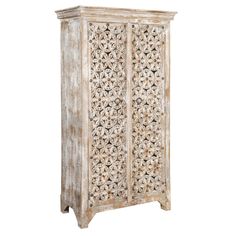 an old white wooden cabinet with intricate carvings on the front and side panels, against a white background