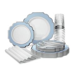 blue and white dinnerware set with silver trimmings on the rimmed plates