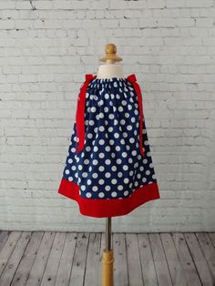 This red, white and blue patriotic dress is perfect for so many holidays or just a cute dress for every day. All dresses are made in my smoke free, pet free studio. Machine wash and tumble dry. For the fit, measure from the shoulder to the desired length. 12 Month - 15 inches 18 Month - 16 inches 2 Toddler - 17 inches 3 Toddler - 18 inches 4 Toddler - 19 inches 5 Toddler - 20 inches 6 Girls - 21 inches 7 Girls - 22 inches Cute Blue Holiday Dress, Cute Navy Dress For Dress-up Occasions, Cute Navy Sleeveless Dress, Cute Sleeveless Navy Dress, Fitted Sleeveless Dress For 4th Of July, Patriotic Blue Dresses For 4th Of July, Blue Patriotic Cotton Dress, Patriotic Blue Cotton Dress, Blue Cotton Patriotic Dress