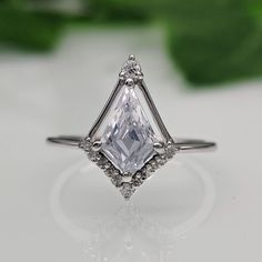 an engagement ring with a large white diamond in the center