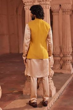 Mustard yellow bundi with floral applique embellishment. Paired with beige kurta and pant. - Aza Fashions Beige Kurta, Kurta Set Men, Yellow Textures, Nehru Jacket, Nehru Jackets, Band Collar, Kurta Set, Floral Applique, Yellow Floral