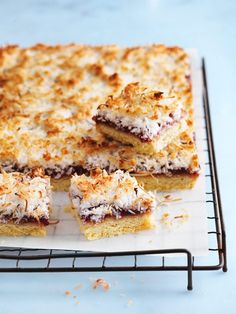 several pieces of cake sitting on top of a cooling rack