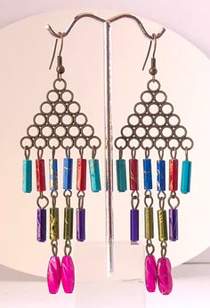 Colorful Dangling Earrings, Perfect for any occasion or gift for your loved ones, beautiful look, Vintage yet stylish, unique design Push back closure Length: 9 cm; Width: 3 cm Artistic Multicolor Dangle Earrings, Multicolor Novelty Dangle Jewelry, Vintage Multicolor Beaded Dangle Earrings, Handmade Multicolor Dangle Clip-on Earrings, Multicolor Dangle Jewelry, Fair Trade, Trendy Earrings, Unique Gifts For Her, Multi Color, Jewelry Earrings Dangle