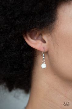 A collection of round and teardrop white stone beads and decorative silver teardrops swing from the bottom of double-link silver chain, creating an earthy fringe below the collar. Features an adjustable clasp closure. Sold as one individual necklace. Includes one pair of matching earrings. White Drop Metal Jewelry, White Metal Jewelry With Silver Beads, White Pearl Jewelry With Silver Beads, White Teardrop Wire Wrapped Earrings, White Metal Teardrop Earrings, Adjustable White Jewelry With Dangling Beads, White Adjustable Jewelry With Dangling Beads, Adjustable Nickel-free White Teardrop Earrings, White Metal Teardrop Earrings With Pearl Drop