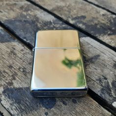 a lighter sitting on top of a wooden table