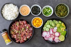 several bowls with different types of food in them