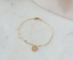 These initial bracelet are a timeless, classic and elegant gift that will always be in style. The perfect birthday gift, for Mom, Grandma or anyone special in your life.  If you're looking to get something special for someone who likes to keep it classy, this bracelet makes a great choice.   ⭐︎ Details:      ♡ 14k Gold Filled Chain High Quality (Tarnish Resistant)      ♡ 100% hypoallergenic, lead and nickel free.     ♡ Waterproof Quality    C A R E ∙ T I P S To maintain the Perfect Quality of your new Velvet Collection Necklace, please: * Wash your bracelet with neutral soap once a week. Don't forget to dry it perfectly! * Gently polish with a soft, lint-free cloth.  * Avoid direct contact with perfumes, body oils, and other chemicals, including household cleaners.  * Store your beloved je Classic Charm Bracelet As Gift, Classic Bracelet Jewelry For Mother's Day, Yellow Gold Mother's Day Bracelets, Yellow Gold Mother's Day Bracelet, Gold Charm Bracelet Gift, Classic Name Bracelet For Mother's Day Gift, Classic Personalized Gold Bracelet Gift, Classic Hypoallergenic Bracelets As Personalized Gift, Classic Hypoallergenic Bracelets For Personalized Gifts