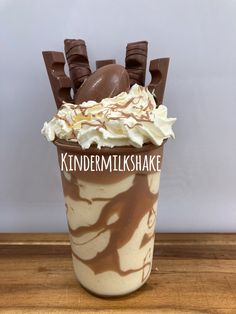 a cup filled with chocolate and whipped cream