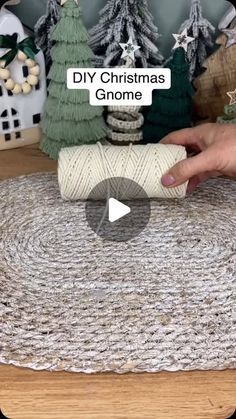 someone is making a christmas decoration with yarn