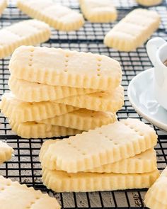 some cookies on a cooling rack with a cup of coffee