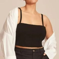 11 Honor Collection Shayla Black Crop Top Plus Size 3 / 22-24 Condition: Brand New Without Tags; No Flaws Size: Women's Plus Size 3 Which Is A Us 22-24 Retail Price: $98.00 Color: Black Material: Blended Fabric With Good Amount Of Stretch This Cropped, Built-In Shelf Bra Tank Has Contoured Seam Details And Adjustable Straps. Since It’s Cut From A Stretchy Ponte Fabric, It’s Super Comfortable. Wear As A Layering Piece Or Go Bold By Wearing Alone. A Sleeveless Plus Size Top To Transform Your Workw Black Top With Built-in Bra For Day Out, Black Tops With Built-in Bra For Day Out, Crop Top Plus Size, Bra Tank, Ponte Fabric, Black Crop Top, Top Plus Size, Plus Size Top, Woven Top