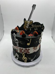 a birthday cake decorated with musical instruments and music notes