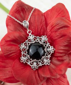 "This beautifully handcrafted filigree art daisy flower pendant feature with Black Onyx gemstone. Exquisitely crafted, handmade daisy flower pendant necklace would be your perfect option for anniversary, birthday, thanksgiving or Christmas gift for yourself or loved one.  For gold plated option, visit that link; https://www.etsy.com/FiligranUSA/listing/1401924202 The optional silver chain length is 18.00\" (45.7 cm)  + 2.00\" (5.10 cm) extension.  The Black Onyx gemstone diameter is 16 mm, cabochon round-cut.  This metal embroidery filigree pendant is oxidized and highly polished. Comes with a velvet pouch, silver polish cloth and a luxurious gift box. What is Filigree Art? Filigree is made of delicate metal strands that have been skillfully fashioned to create an outstanding combination o Black Filigree Pendant Jewelry, Black Flower Charm Pendant Jewelry, Black Flower Charm Jewelry, Black Jewelry With Flower Charm Pendant, Black Jewelry With Flower Charm As Gift, Black Flower Jewelry For Gift, Black Intricate Design Jewelry As Gift, Elegant Black Flower Pendant Jewelry, Onyx Cabochon Jewelry Gift