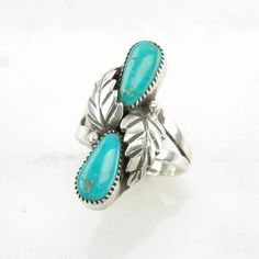 This ring is a size 6 1/2 (USA); It may be resized. Markings: Unrecognizable makers mark  (Tested & guaranteed to be Sterling Silver) This ring weighs 5.4 Grams The Stone/Design is Blue Turquoise Floral      The Stone/Design measures 11 x 5.7 mm  The Ring face measures 28.3 x 13.1 mm  The condition of this ring is Estate, Great, moderate patina  This vintage item is circa 1970 To have us do the resize, add this listing and the resize listing to your cart and select which size you would like this Southwestern Turquoise Teardrop Ring, Southwestern Style Blue Nickel-free Rings, Vintage Turquoise Promise Ring, Southwestern Blue Teardrop Ring, Southwestern Teardrop Blue Rings, Turquoise Vintage Promise Ring, Adjustable Open Turquoise Ring For Anniversary, Southwestern Blue Open Ring Jewelry, Southwestern Blue Rings For Anniversary