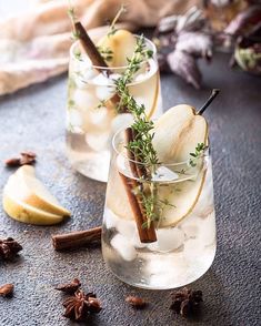 two glasses filled with ice and apple slices