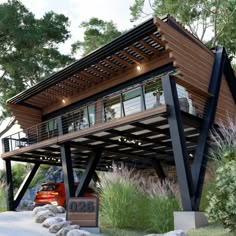 a large wooden structure sitting on top of a lush green hillside next to trees and bushes