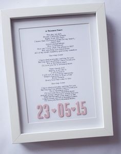 a white frame with a poem written in pink on the bottom and numbers below it