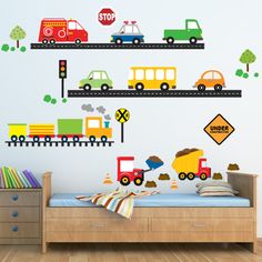 a child's bedroom with train and cars wall decals