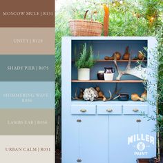 a blue cabinet with plants and other items on it