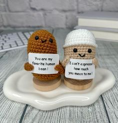 two crocheted figurines holding signs that say you are my favorite human and how much i mean to me