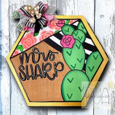 a wooden sign that says mom shara with a cactus and flowers on the front