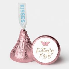 a pink foiled herss candy bar with a baby shower tag on the top