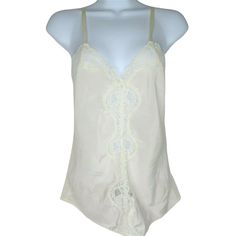 Vintage 1964 Deena White Camisole S Lace Trim Nylon Satin Made in USA Brand: Deena Made in USA 100% Polyester Tag Size: 32 = Modern X-Small Chest: 14" across/Underarms Length: 14" downside seam Pre-Owned - Nice Vintage Condition - Lace is intact but has areas that show light wear - SEE ALL PHOTOS item#000/062821 Cheap White Feminine Camisole, Cheap Lace Stretch Camisole, Cheap Fitted Lace Trim Camisole, Cheap Lace Trim Camisole For Daywear, Affordable Cotton Lace Trim Camisole, Cheap Intimates With Lace Trim And Spaghetti Straps, Cheap Vintage Summer Camisole, Cheap Vintage Camisole For Spring, Cheap Feminine Lace Trim Camisole