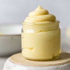 a jar filled with whipped cream sitting on top of a table