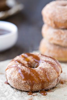 two glazed donuts sitting on top of a table