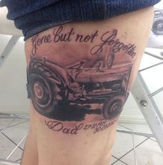 a man with a tattoo on his leg that says gone but not forgotten, dad