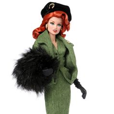 a barbie doll dressed in green and black holding a fur stole, hat and gloves