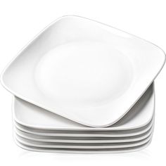 stack of white plates stacked on top of each other in front of a white background