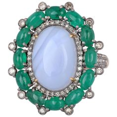 This ring is crafted in 18-karat gold and sterling silver. It is hand set in 5.67 carats opal, 2.76 carats emerald and 1.35 carats of diamonds. FOLLOW MEGHNA JEWELS storefront to view the latest collection & exclusive pieces. Meghna Jewels is proudly rated as a Top Seller on 1stDibs with 5 star customer reviews. All items manufactured by us are handmade and can be customized or redesigned. Composition Gold Weight(Gms)-1.8 Silver Weight-4.75 Diamond Wt(Cts)-1.35 Emerald Wt(Cts)-2.76 Opal -5.67 Blue Sapphire Diamond Ring, Platinum Diamond Rings, Emerald Diamond Ring, Diamond Jewelry Designs, Blue Sapphire Diamond, Diamond Cocktail Rings, Sapphire Diamond Ring, Eternity Ring Diamond, Crown Jewels