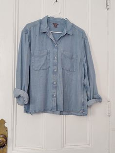 "Eddie Bauer heavy chambray button down blouse. Clearly preowned with heavy signs of wear yet still full of life! Size:  Large Chest: 47 \" Waist: 48\" Shoulder - Shoulder: 19 \" Shoulder - Hem: 24 \" Sleeve: 23.5\"" Club Red, Portland Me, Womens Blouses, Black Lightning, Work Shirt, Chambray Shirt, Button Down Blouse, Work Shirts, Life Size