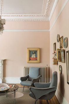 a living room filled with furniture next to a fire place in a fireplace mantel